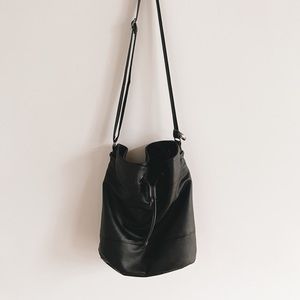 Black faux-leather bucket bag